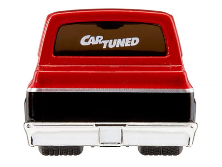 Red and black toy truck from the rear.