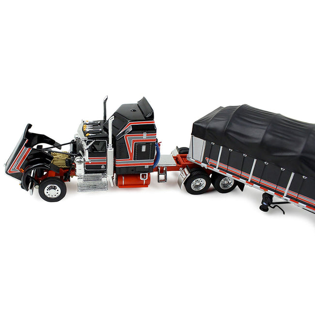 Peterbilt 389 with 63" Flat Top Sleeper and 53’ Wilson Roadbrute Flatbed Trailer with Covered Wagon Maroon with White Stripes 1/64 Diecast Model by DCP/First Gear