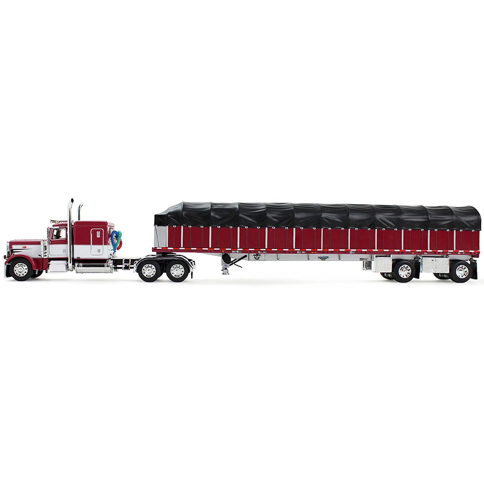 Toy red and white semi-truck with trailer.