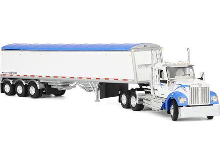 Model semi-truck with white trailer and blue accents.
