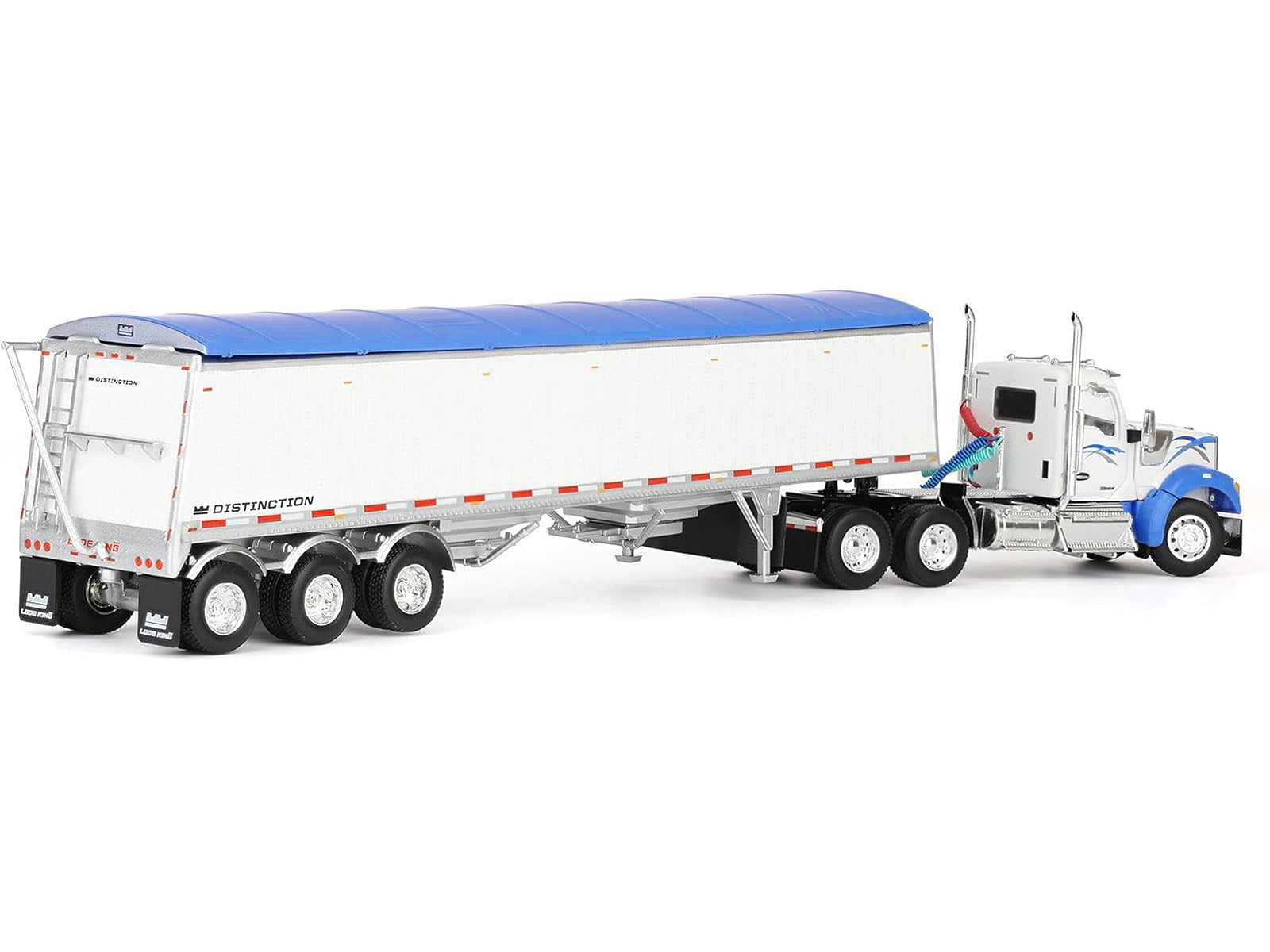 Toy truck with a white trailer and blue tarp.
