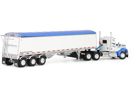 Toy truck with a white trailer and blue tarp.