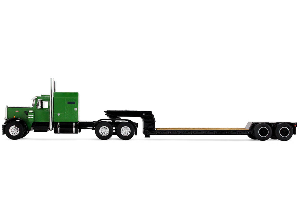 Green semi-truck with a flatbed trailer.