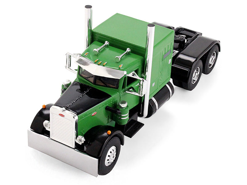 Green and black semi-truck model.
