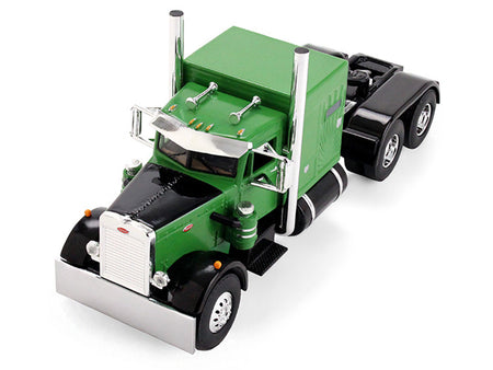 Green and black semi-truck model.