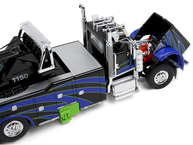 Peterbilt 389 Day Cab with Miller Century 1150 Rotator Wrecker Tow Truck Black with Blue and Green Graphics 1/64 Diecast Model by DCP/First Gear