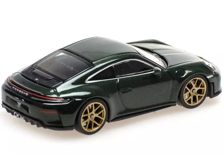 Green Porsche sports car with gold wheels.