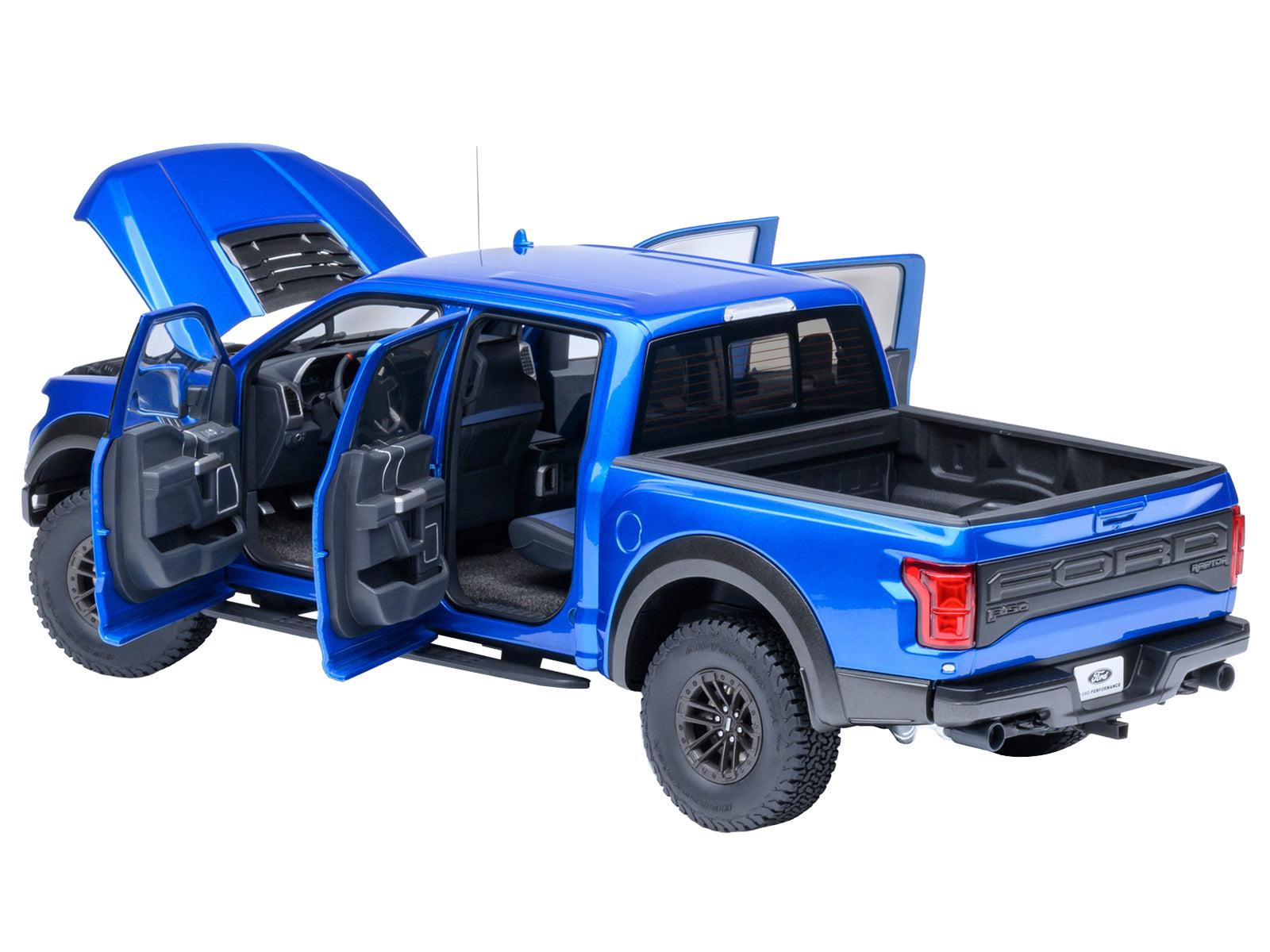 Blue Ford Raptor truck with doors and hood open.