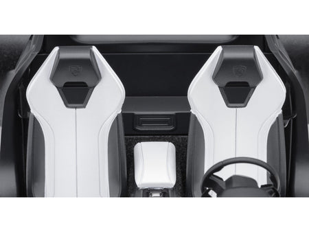 Car interior with white seats and steering wheel.