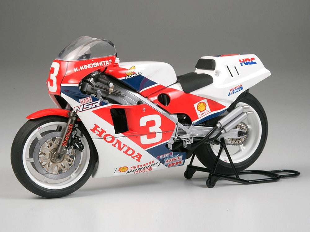 Red, white, and blue Honda motorcycle model with number 3.