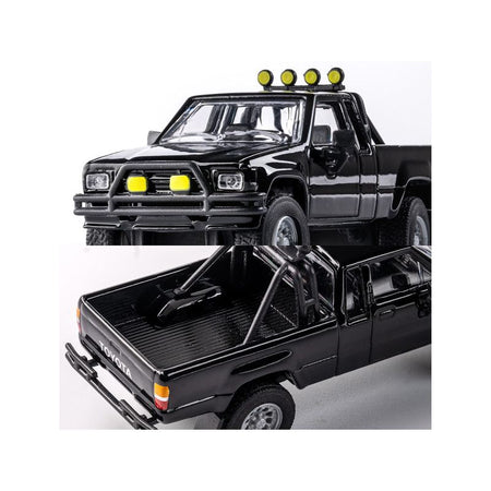Black toy pickup truck with lights.