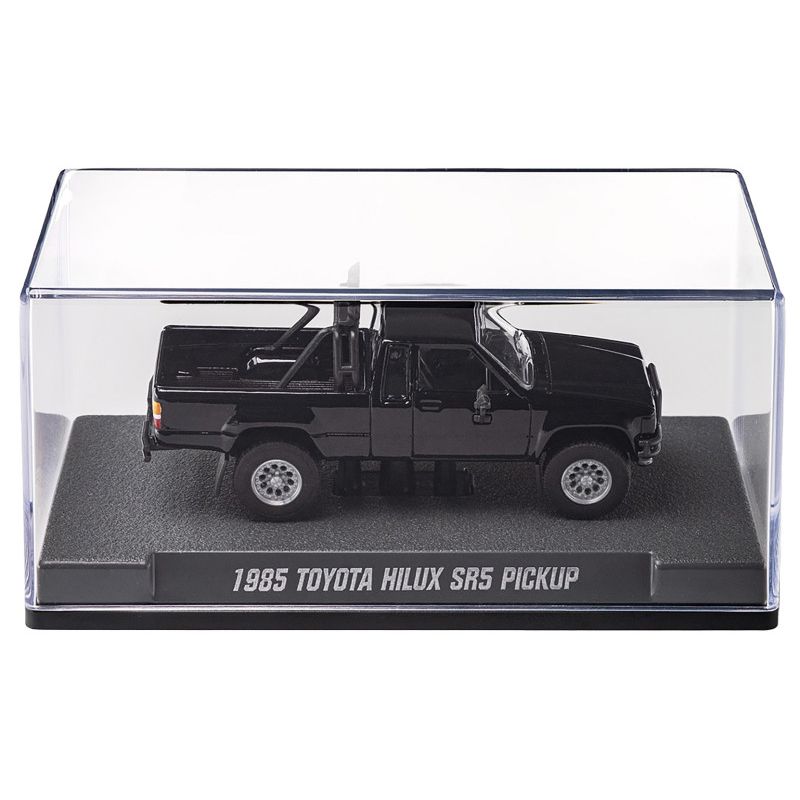 Black toy truck in clear display case.