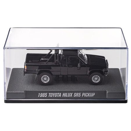 Black toy truck in clear display case.