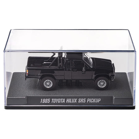 Black toy truck in a clear display case.