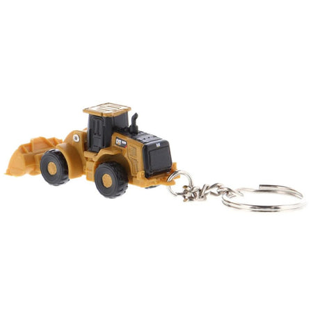 Toy yellow front-end loader keychain.