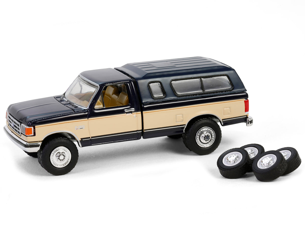 1991 Ford F-150 XLT Lariat Pickup Truck with Camper Shell Deep Shadow Blue and Tan with Spare Tires "The Hobby Shop" Series 16 1/64 Diecast Model Car by Greenlight