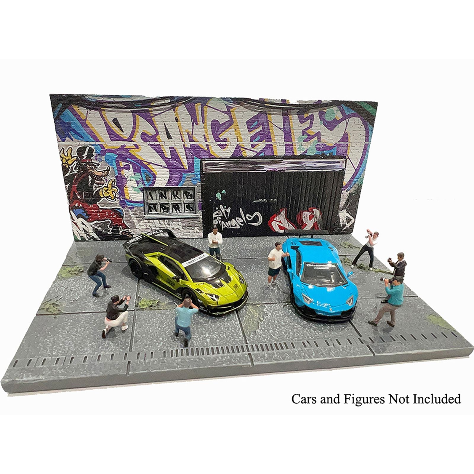 AD-2424MJ-2 diorama with cars and figures in front of graffiti wall