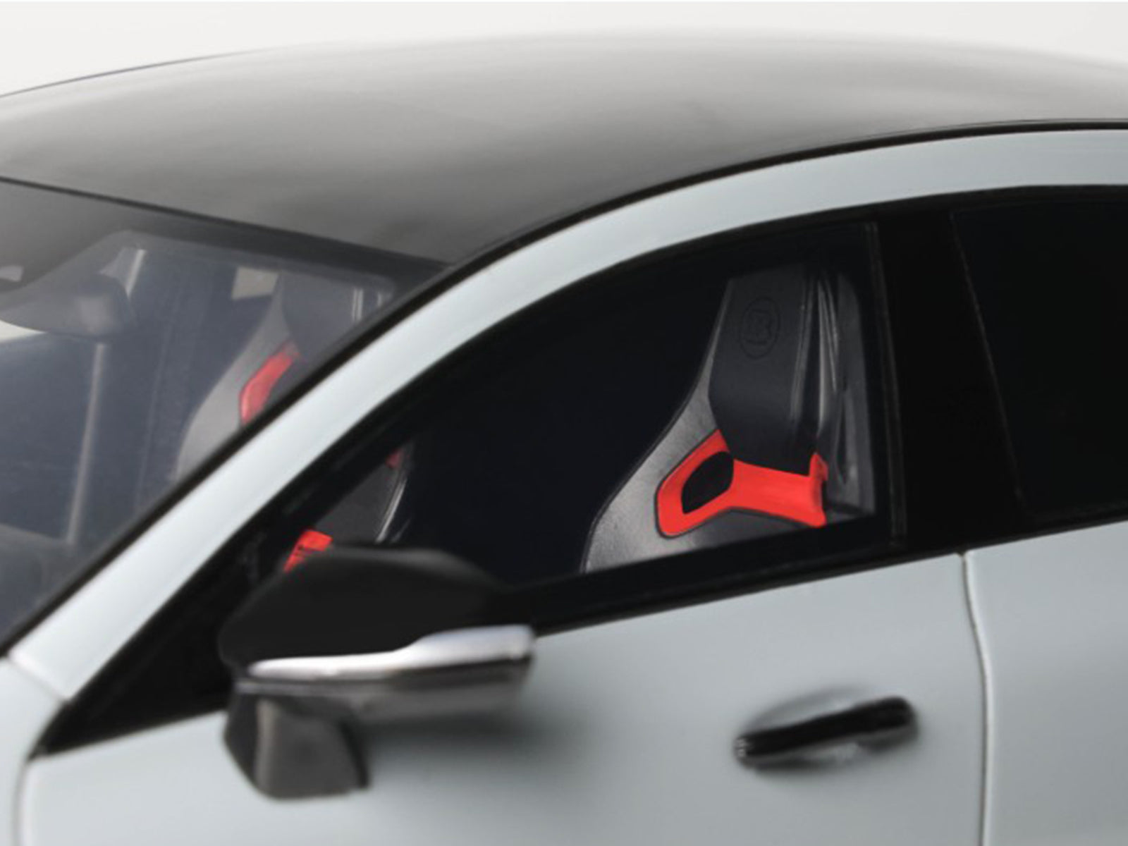 Car interior detail with red accents.