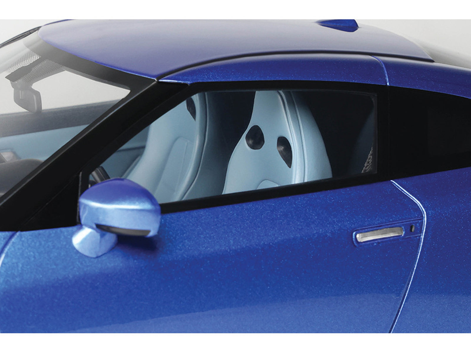 Blue GT521-2 Nissan car interior with white seats