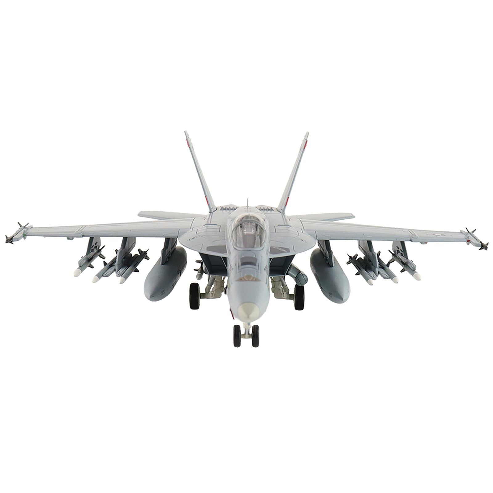 Front view of military jet with missiles.