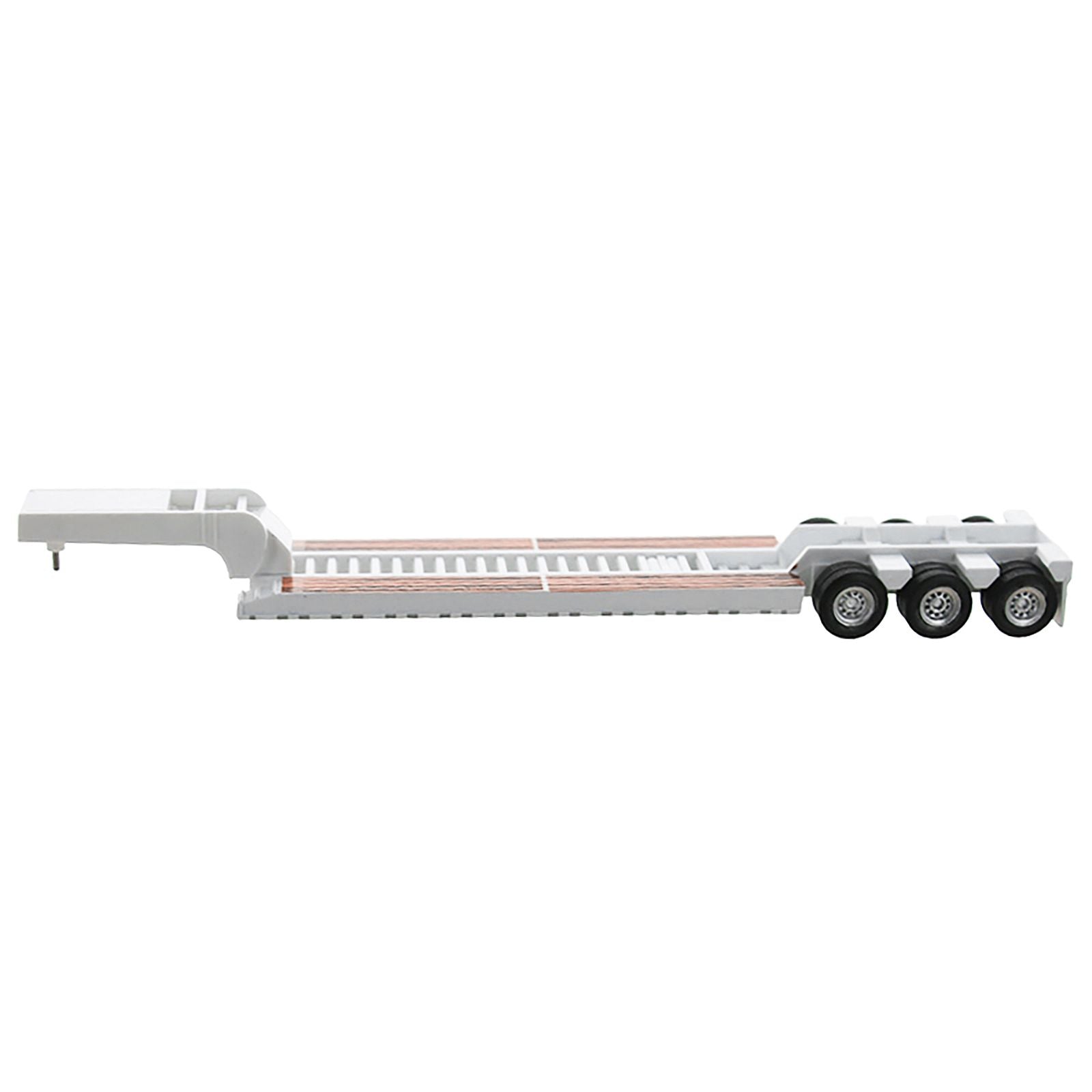White lowboy trailer with triple axle