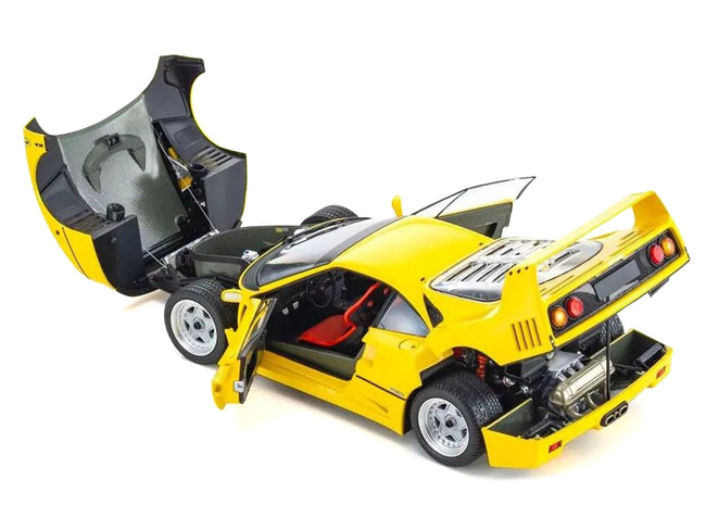 Yellow Ferrari F40 model car with open hood and doors