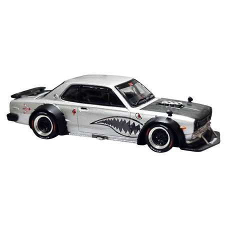 Silver custom car with shark mouth graphic
