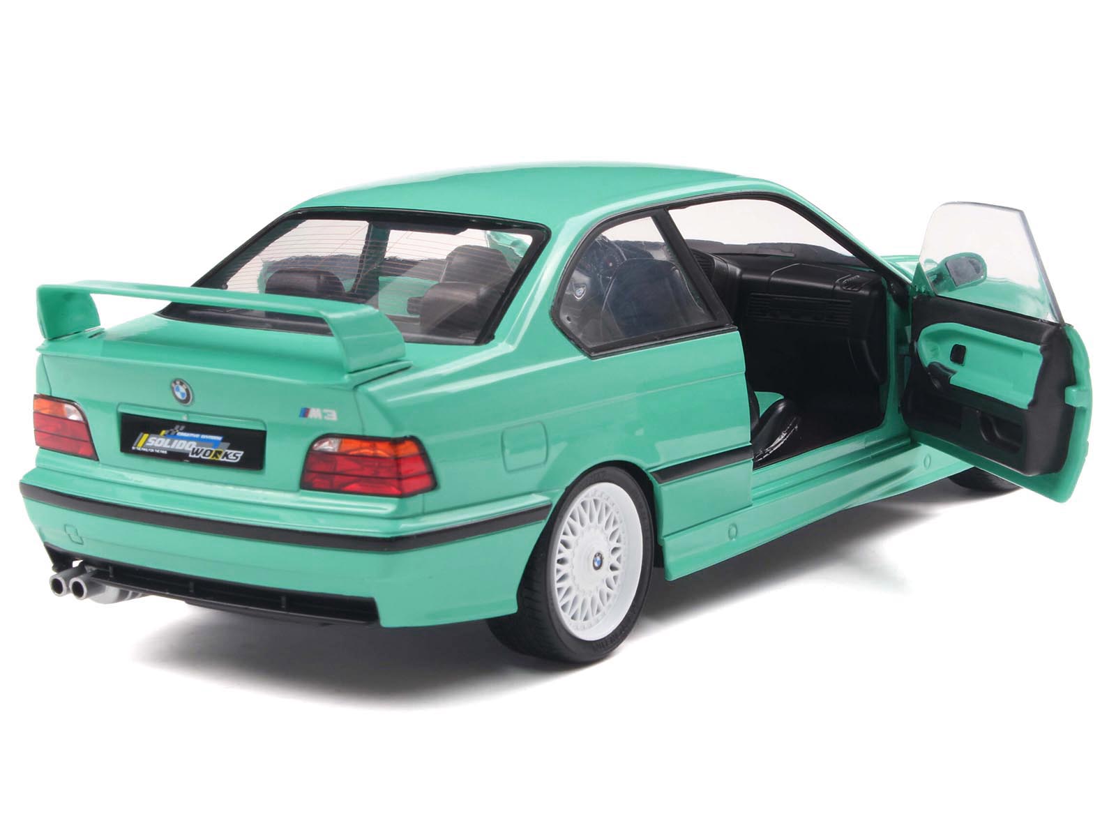 Green BMW M3 model car with open doors