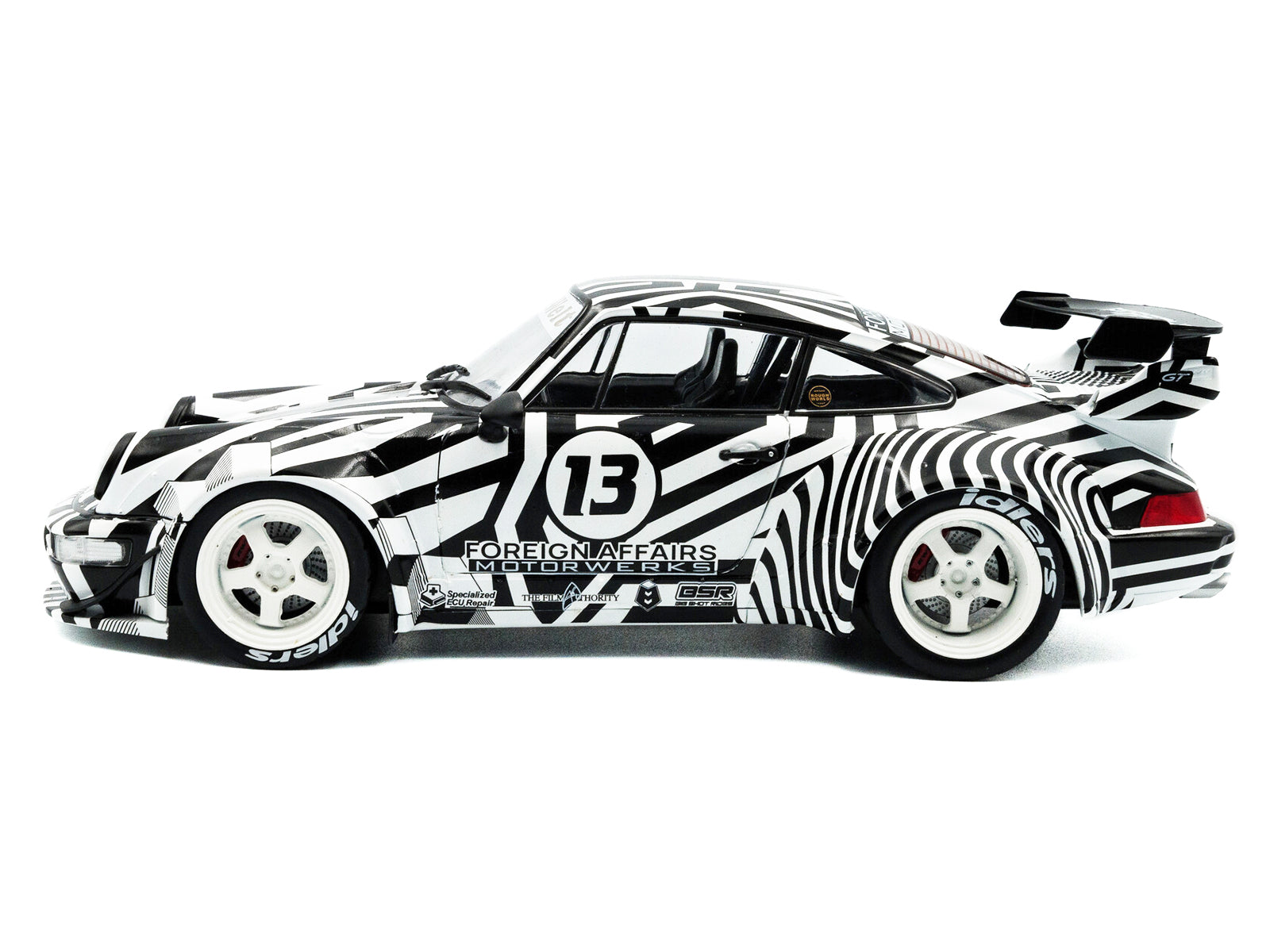 Zebra-striped race car, number 13.