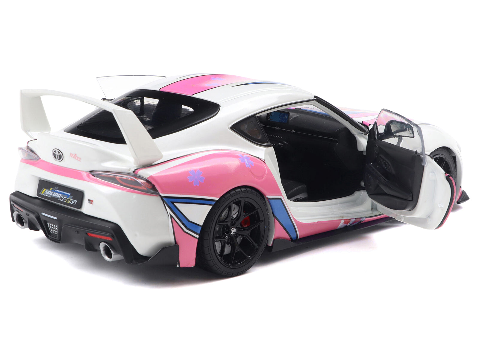Toyota Supra model car with pink and white design