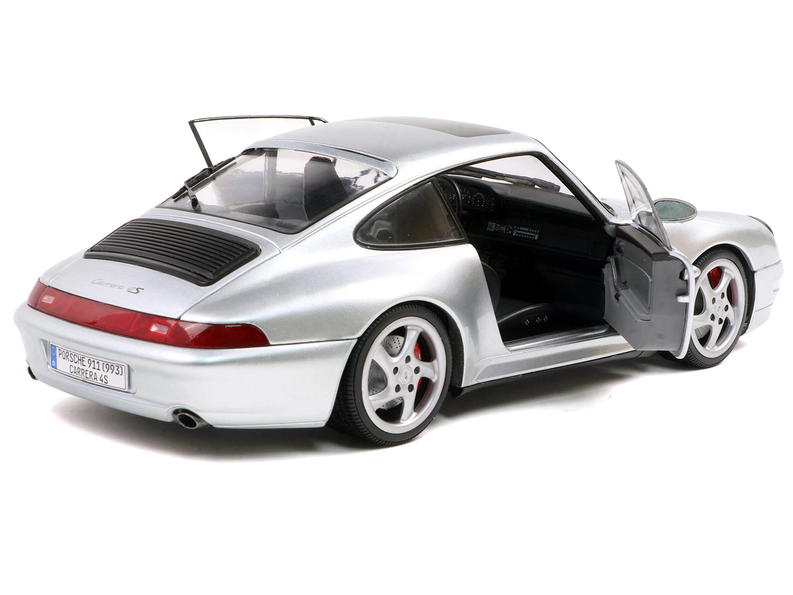 Silver Porsche 911 Carrera 4S with open doors
