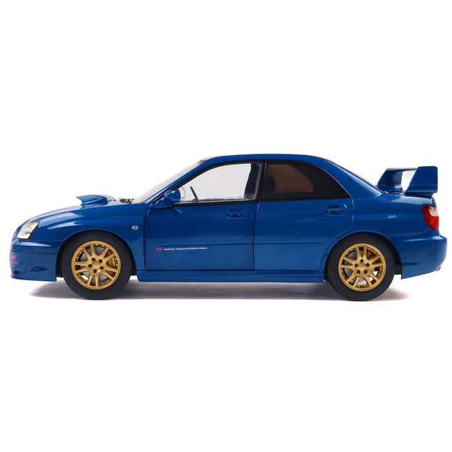 2003 Subaru Impreza WRX STI RHD (Right Hand Drive) Sonic Blue Metallic with Gold Wheels 1/18 Diecast Model Car by Solido