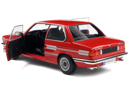 Red Alpina BMW 323i model car with doors open