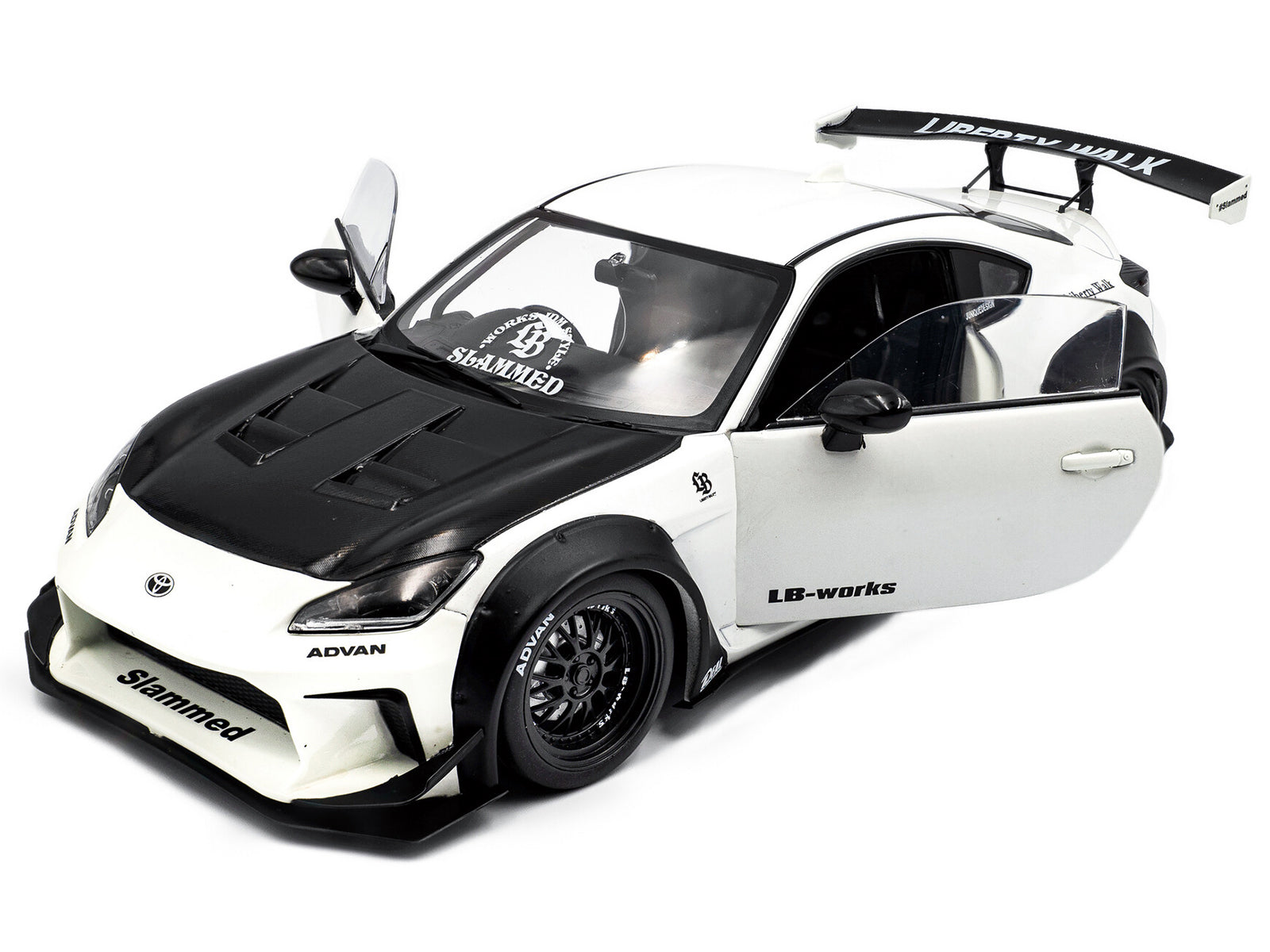 White & black custom sports car model with open doors.