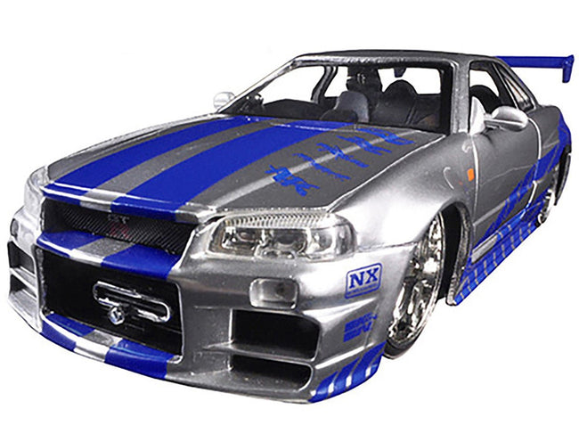 Brian's Nissan GTR Skyline R34 RHD (Right Hand Drive) Silver with Blue Stripes "Fast & Furious 25th Anniversary" 1/24 Diecast Model Car by Jada-Jada-ModelCars.com