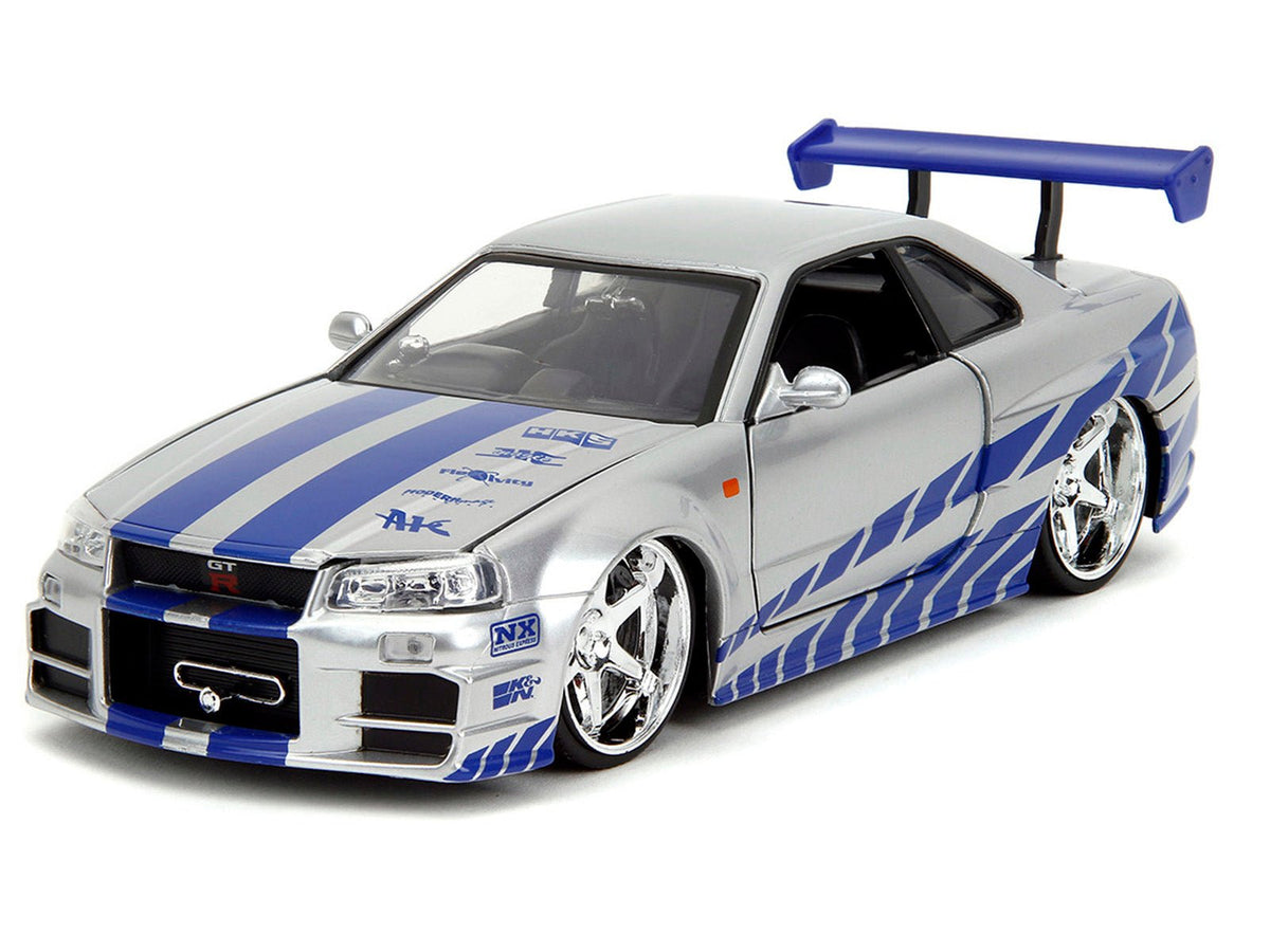 Brians Nissan Skyline GT-R (R34) Silver Metallic with Blue Stripes and Sukis Honda S2000 Pink with Graphics Set of 2 Cars "Fast & Furious 25th Anniversary" "Fast & Furious" Series 1/24 Diecast Model Cars by Jada-Jada-ModelCars.com