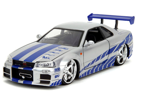 Brians Nissan Skyline GT-R (R34) Silver Metallic with Blue Stripes and Sukis Honda S2000 Pink with Graphics Set of 2 Cars "Fast & Furious 25th Anniversary" "Fast & Furious" Series 1/24 Diecast Model Cars by Jada-Jada-ModelCars.com