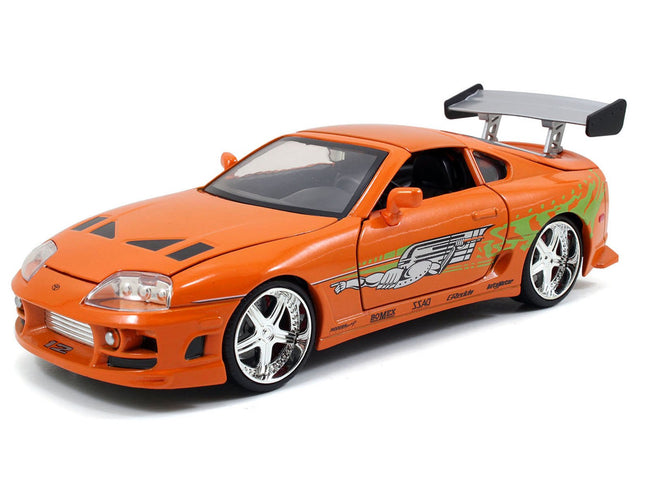 Doms 1970 Dodge Charger R/T Black and Brians Toyota Supra Orange with Graphics Set of 2 Cars "Fast & Furious 25th Anniversary" "Fast & Furious" Series 1/24 Diecast Model Cars by Jada-Jada-ModelCars.com