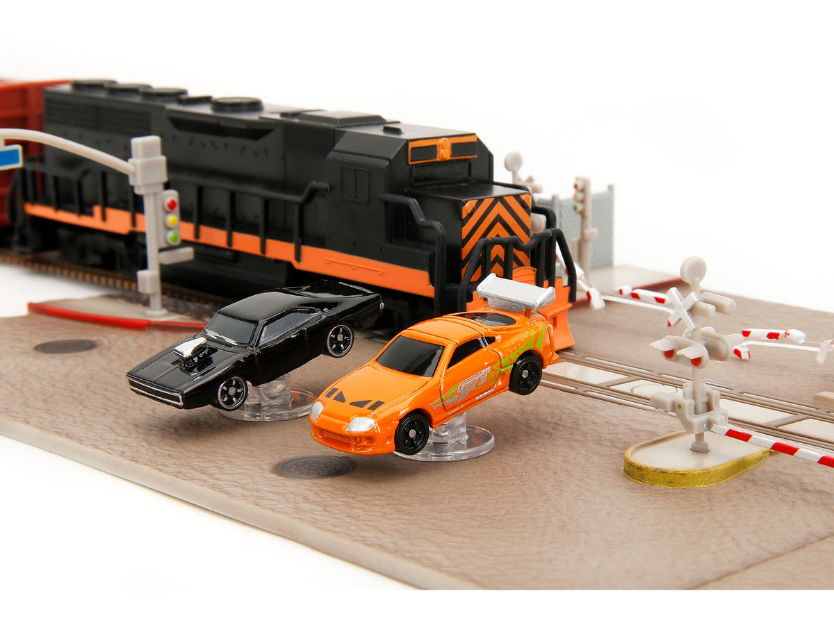 "Fast & Furious" Final Race Diorama with Toyota Supra Orange and Dodge Charger Black "Nano Scene" Series model by Jada-Jada-ModelCars.com