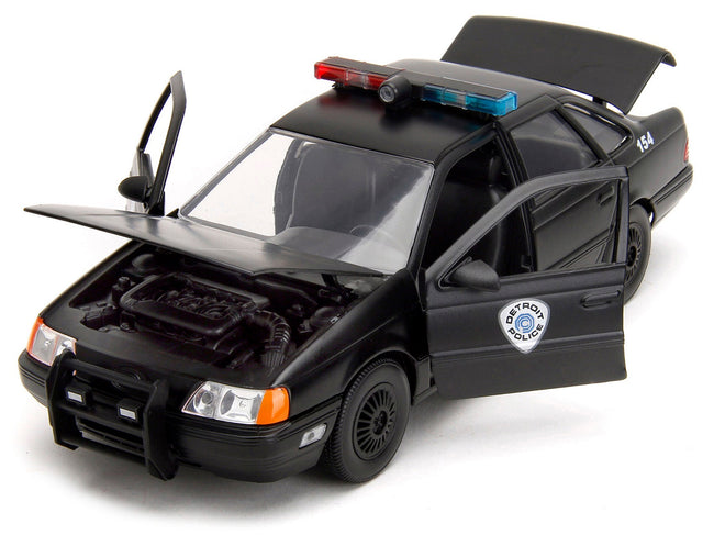 Ford Taurus OCP Matt Black "Detroit Police" and Robocop Diecast Figure 35th Anniversary "Robocop" (1987) Movie "Hollywood Rides" Series 1/24 Diecast Model Car by Jada-Jada-ModelCars.com