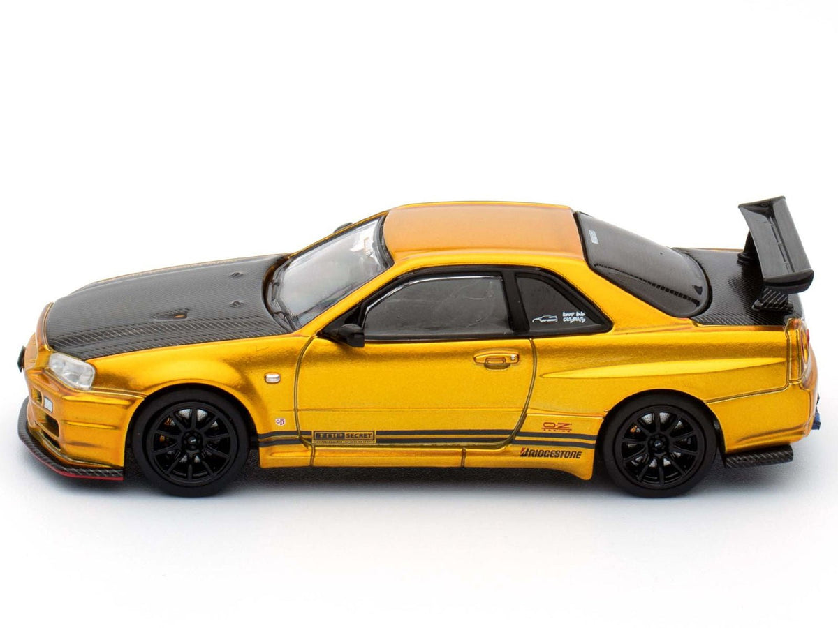 Nissan Skyline GT-R (R34) "Top Secret" RHD (Right Hand Drive) Gold Metallic with Carbon Hood and Trunk "Tokyo Auto Salon 2024 - Malaysia Diecast Expo 2024" 1/64 Diecast Model Car by Inno Models-Inno Models-ModelCars.com