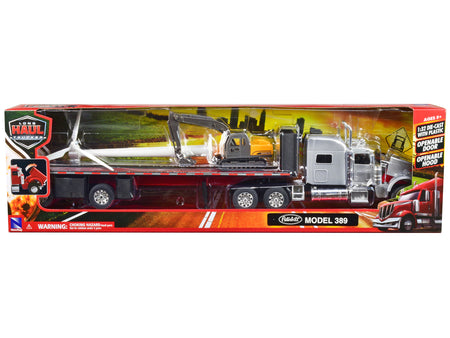 Peterbilt 389 Truck with Flatbed Trailer Silver Metallic with Excavator and Wind Turbine "Long Haul Truckers" Series 1/32 Diecast Model by New Ray - view 3
