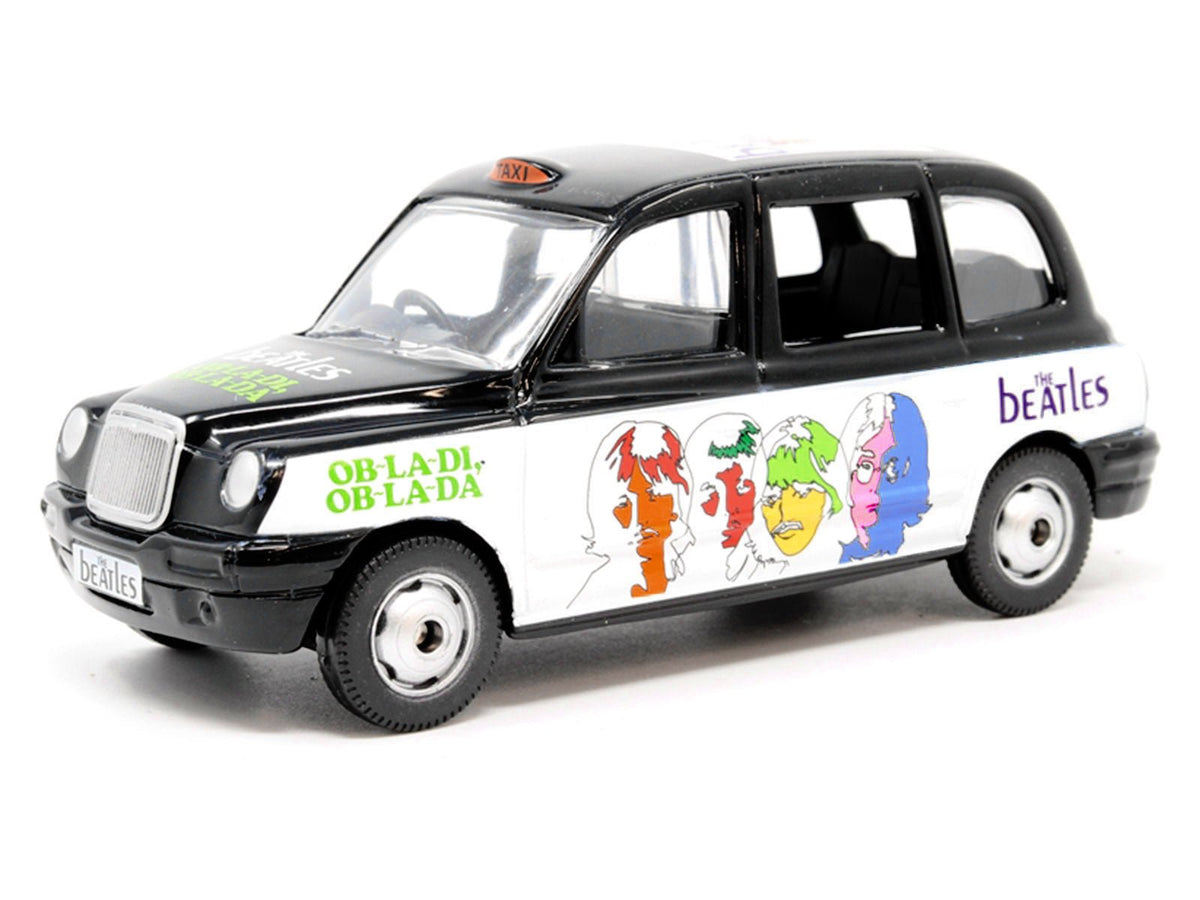 The Beatles London Taxi RHD (Right Hand Drive) "Ob-La-Di Ob-La-Da" Black and White with Graphics Diecast Model by Corgi-Corgi-ModelCars.com
