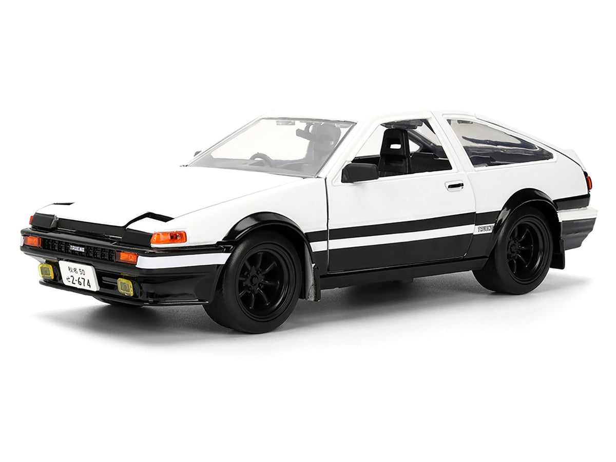 Toyota Trueno (AE86) RHD (Right Hand Drive) White and Black with Graphics and Takumi Diecast Figure "Initial D" (1998-2021) TV Series "Anime Hollywood Rides" Series 1/24 Diecast Model by Jada-Jada-ModelCars.com
