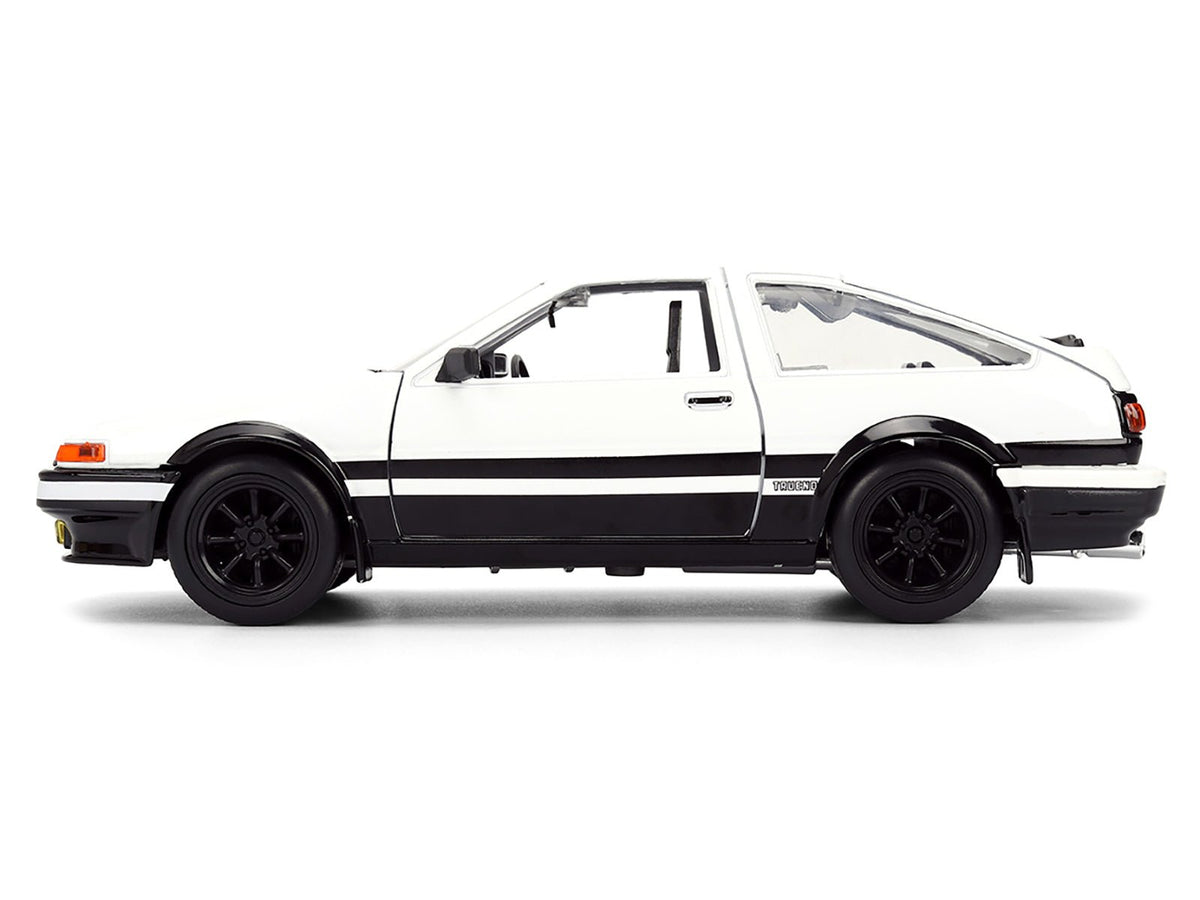 Toyota Trueno (AE86) RHD (Right Hand Drive) White and Black with Graphics and Takumi Diecast Figure "Initial D" (1998-2021) TV Series "Anime Hollywood Rides" Series 1/24 Diecast Model by Jada-Jada-ModelCars.com